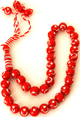 Chapelet "Sebha" rouge-bordeaux a 33 grains avec motifs argentes